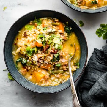 Grey bowl filled with serving of Everything But the Kitchen Sink Soup