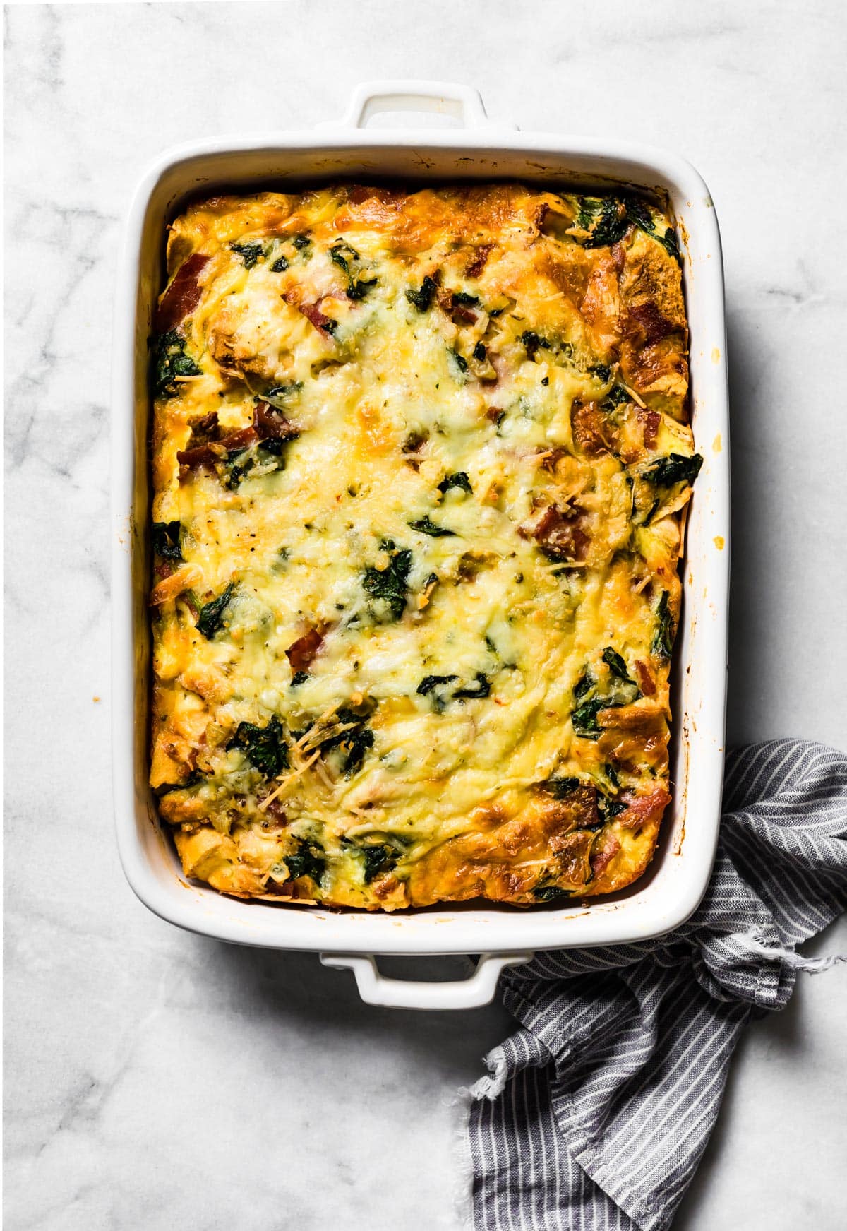 Overhead photo of a white baking pan with baked gluten free breakfast strata.