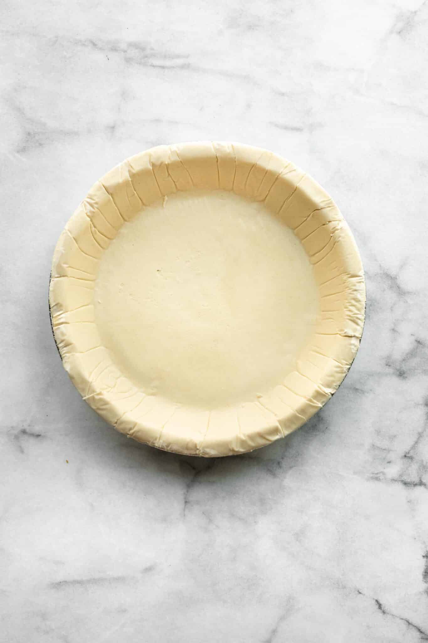 overhead photo of unbaked gluten free store bought pie crust