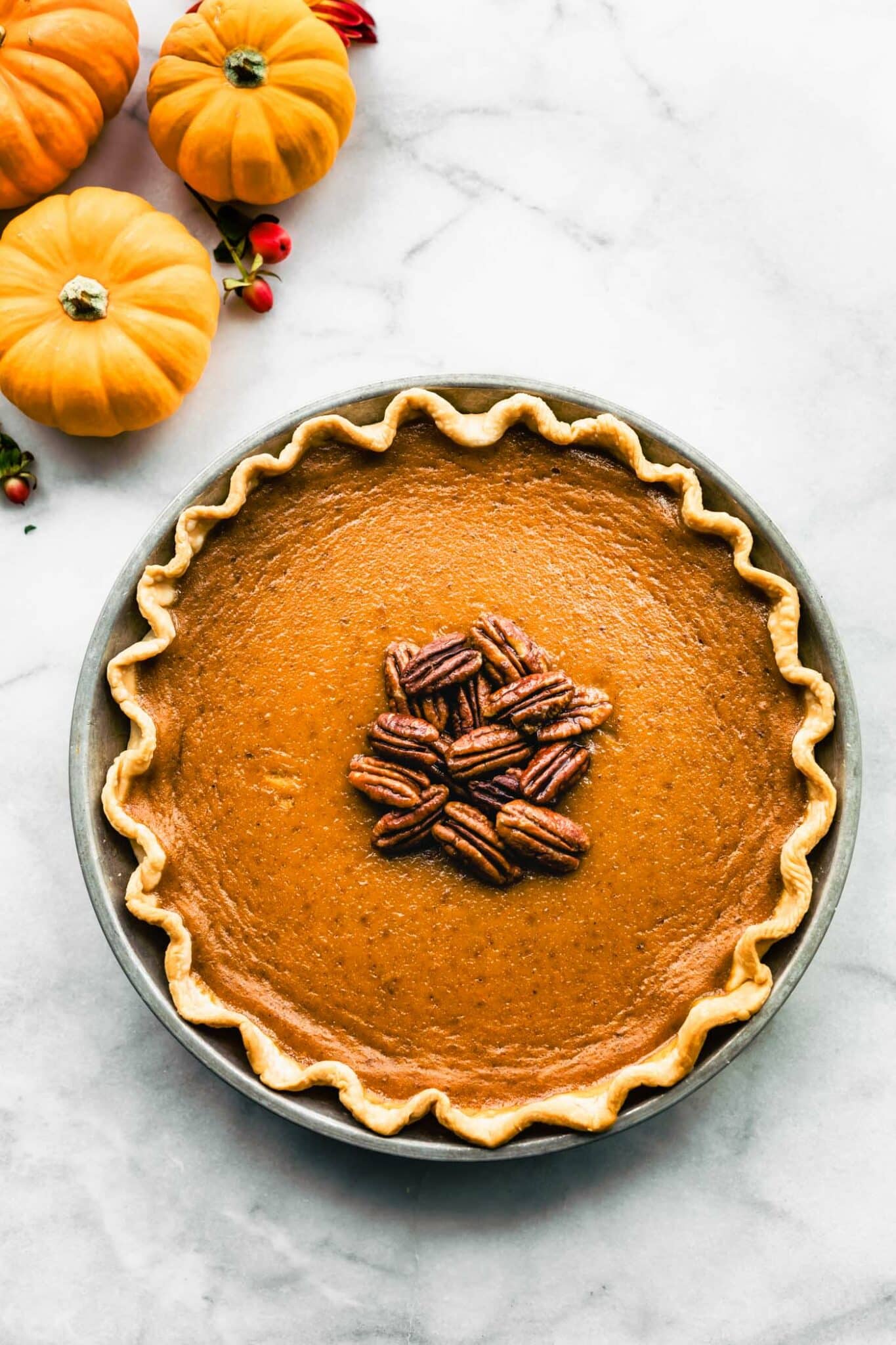 Overhead photo of a dairy free pumpkin pie in a homemade gluten free pie crust.