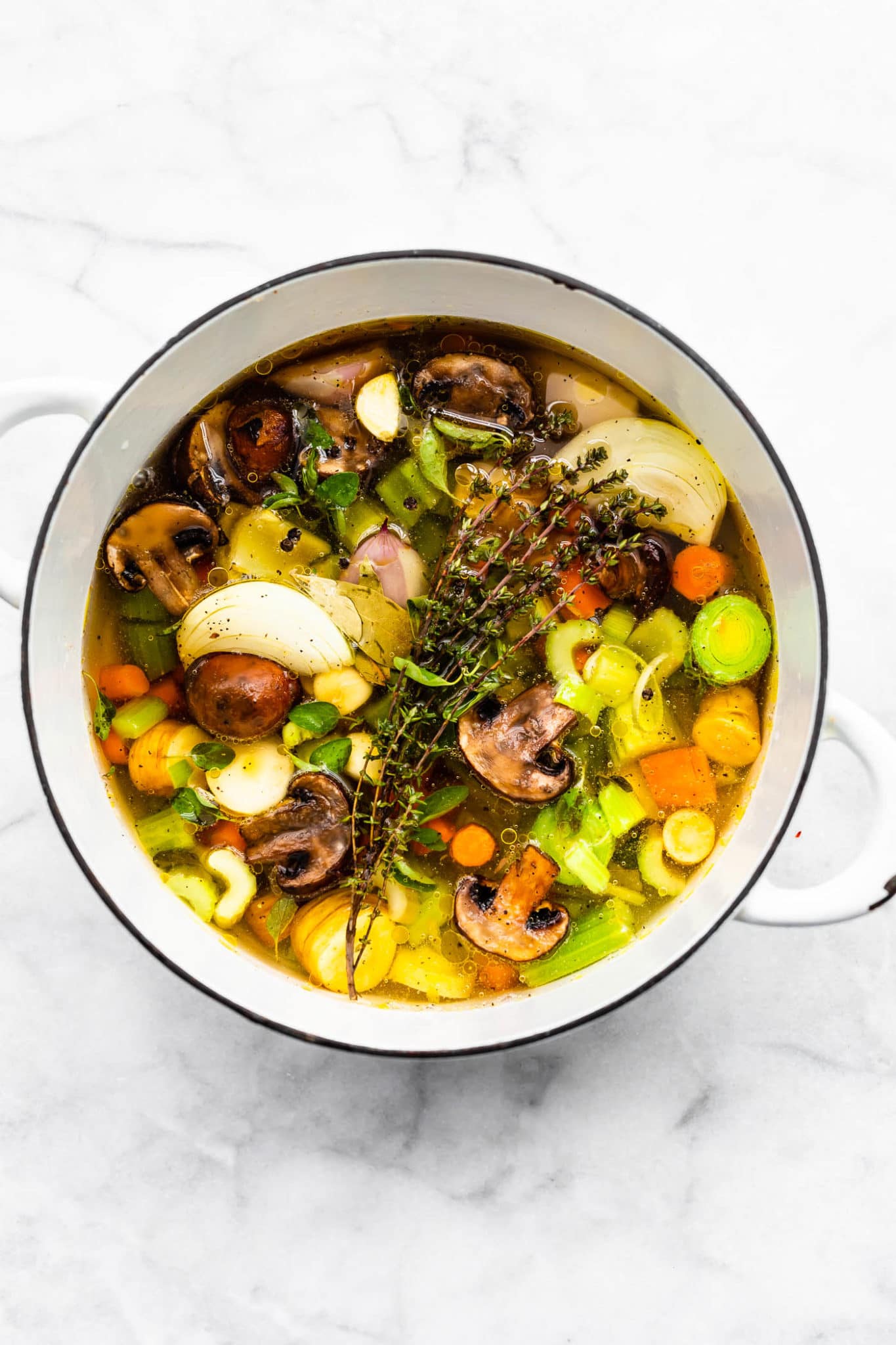 a large pot full of vegetables creating vegetable broth.