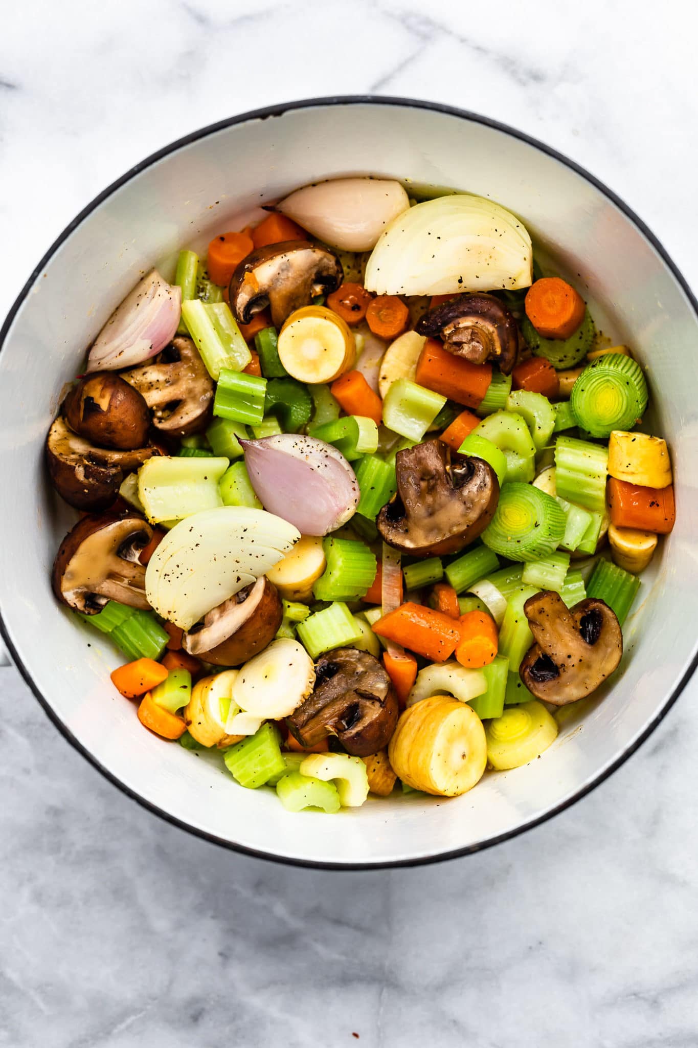 various chooped vegetables in a pot to make vegetable broth.