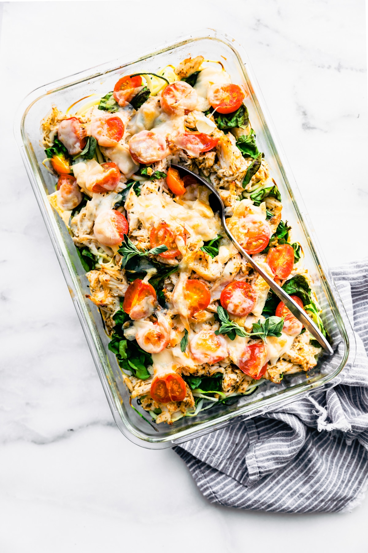 keto meal prep casserole made with chicken and veggies with melted cheese on top.