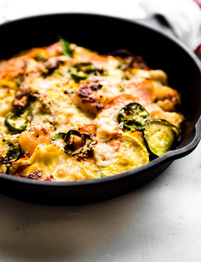 gluten free shrimp and veggie dinner in a cast iron skillet