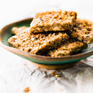 Side view turquoise bowl filled with paleo baklava bars