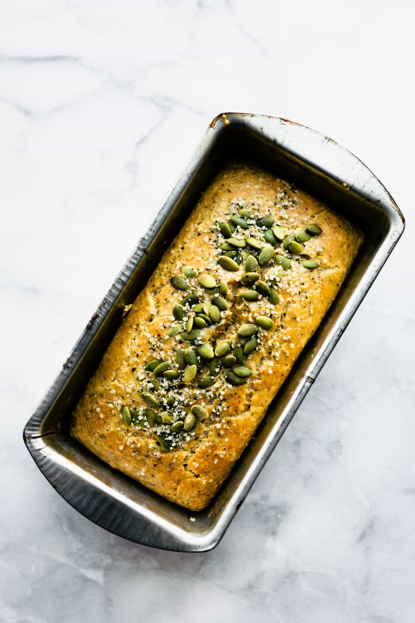 Overhead photo of grain free paleo bread in a metal loaf pan.