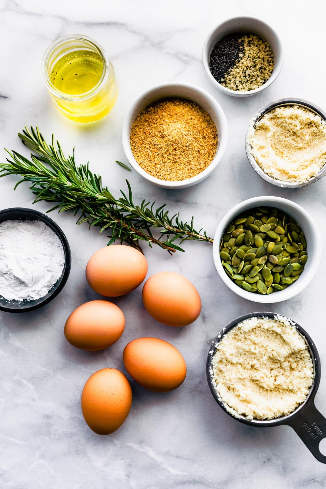 Ingredients in prep bowls to make a paleo grain free bread recipe.