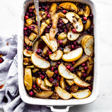 Overhead view white baking dish filled with hot fruit bake