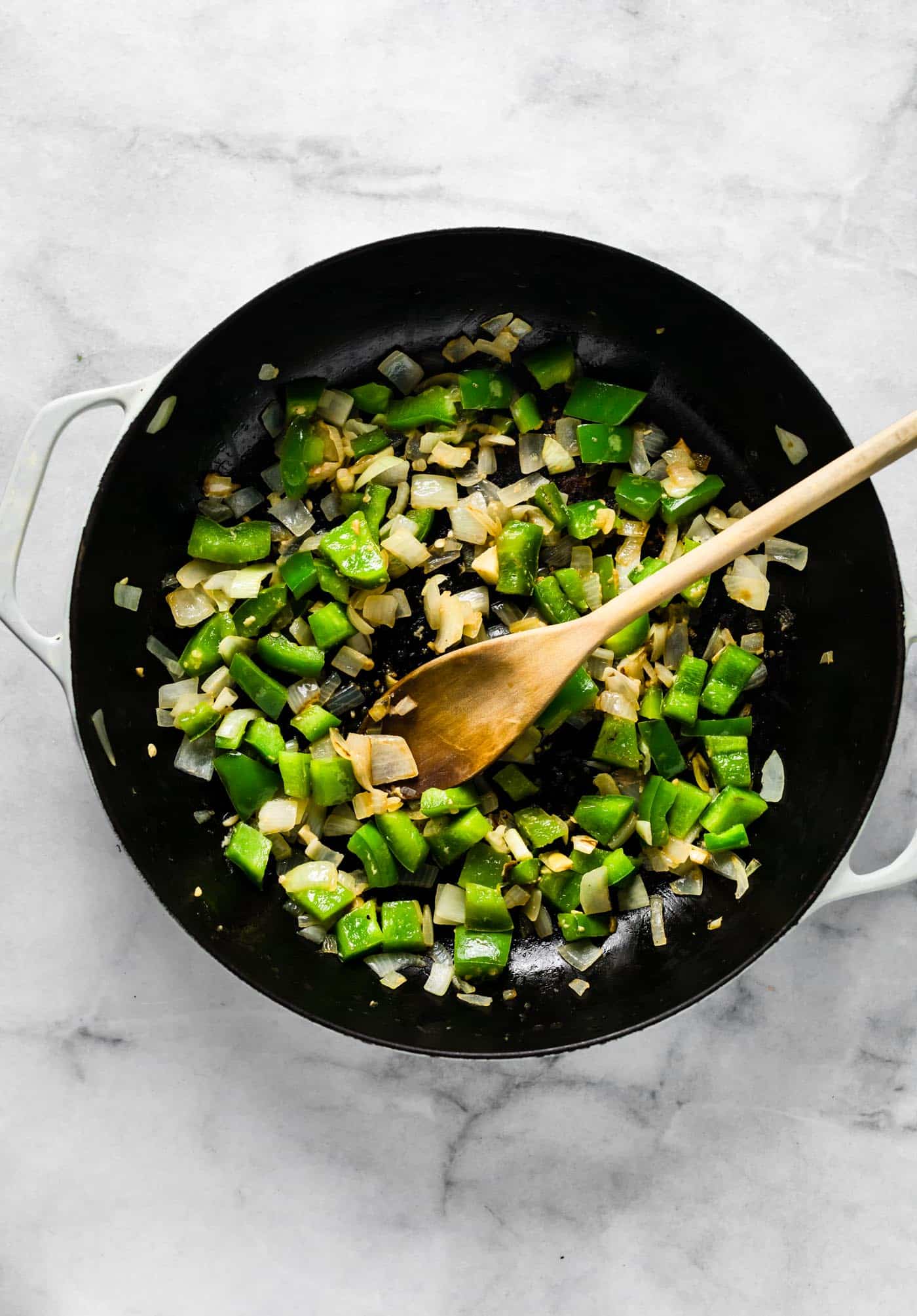 Sauteed onions and bell pepper in a large saute pan.