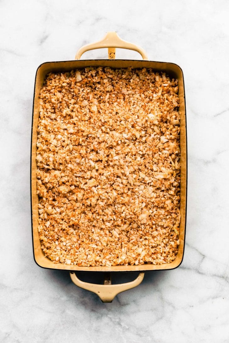 an overhead image of tex-mex egg and cauliflower casserole in a baking dish