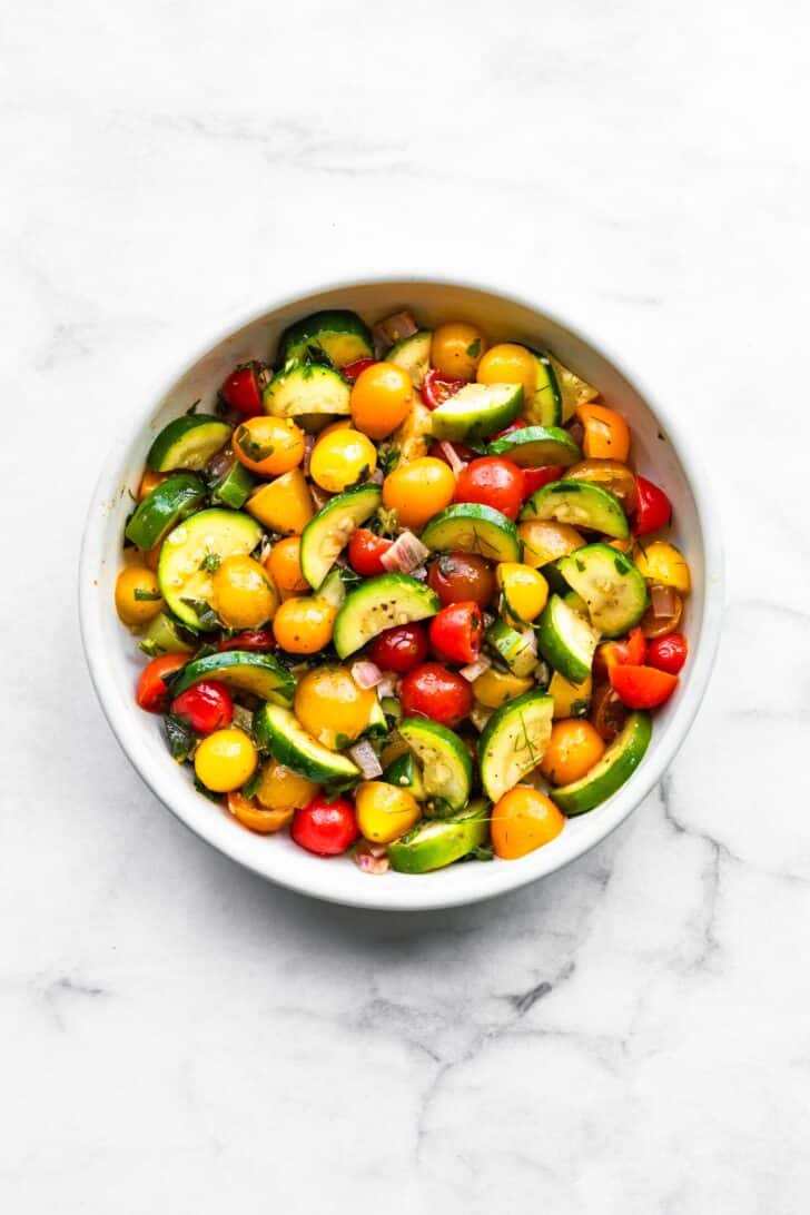 healthy marinated vegetables salad with tomatoes and zucchini.