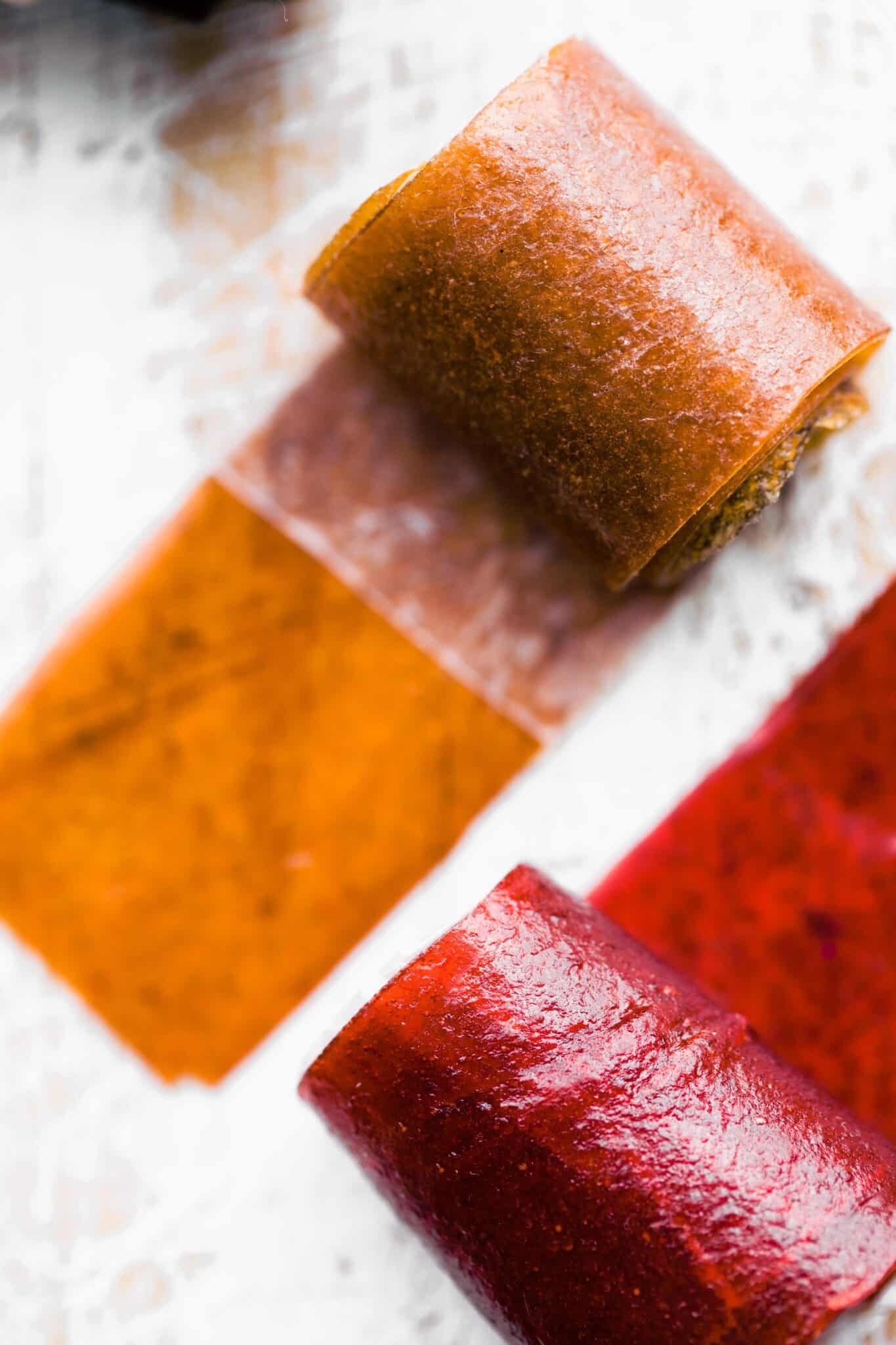 Overhead photo of two different colored fruit roll ups.