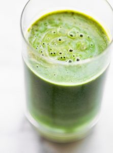 Close up image of superfood green kiwi smoothie with spirulina