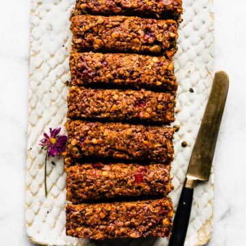 Overhead photo of a glazed vegan lentil loaf with a knife on the side.