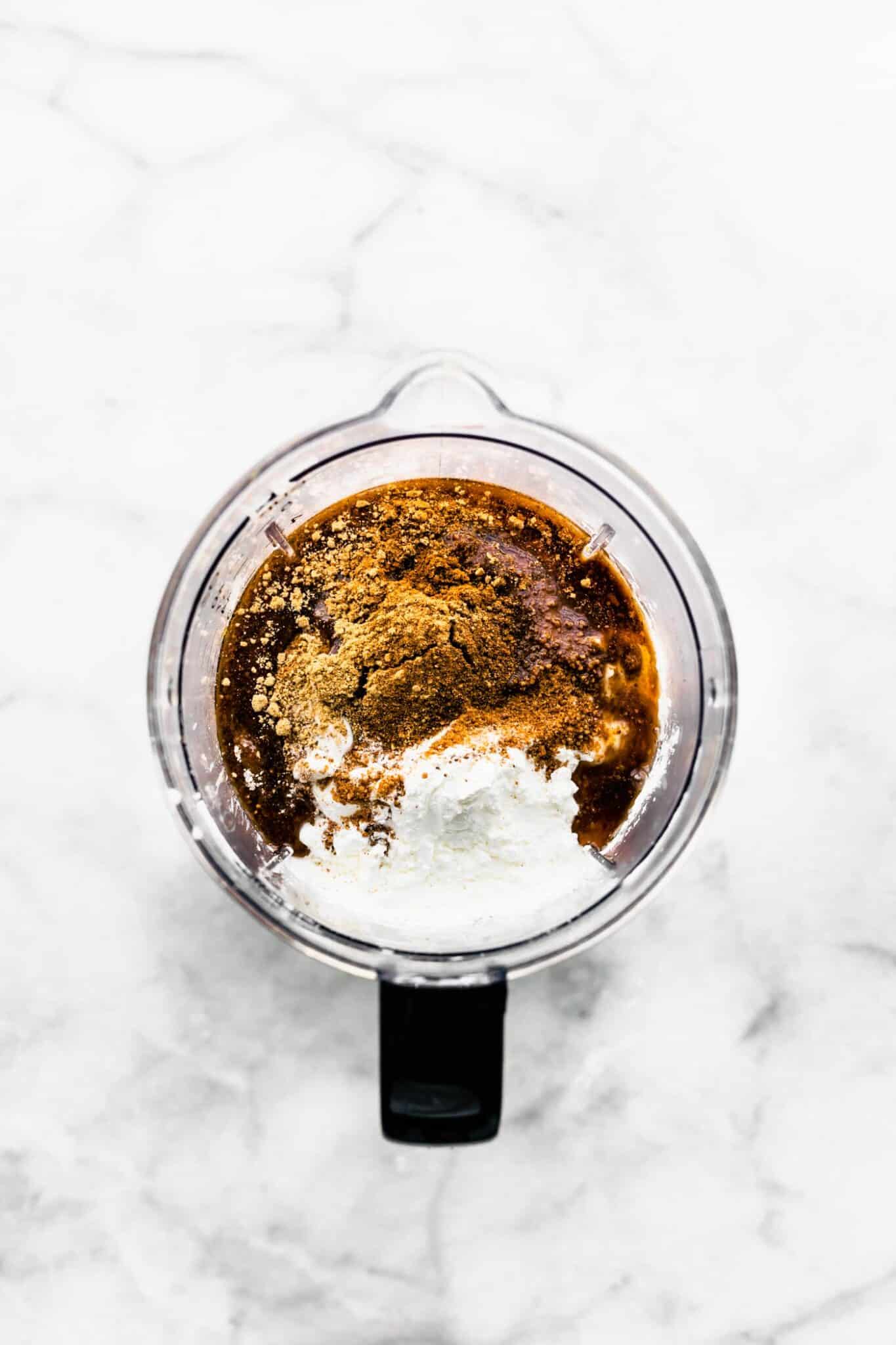 Maple syrup, pumpkin puree and coconut cream in a food processor.