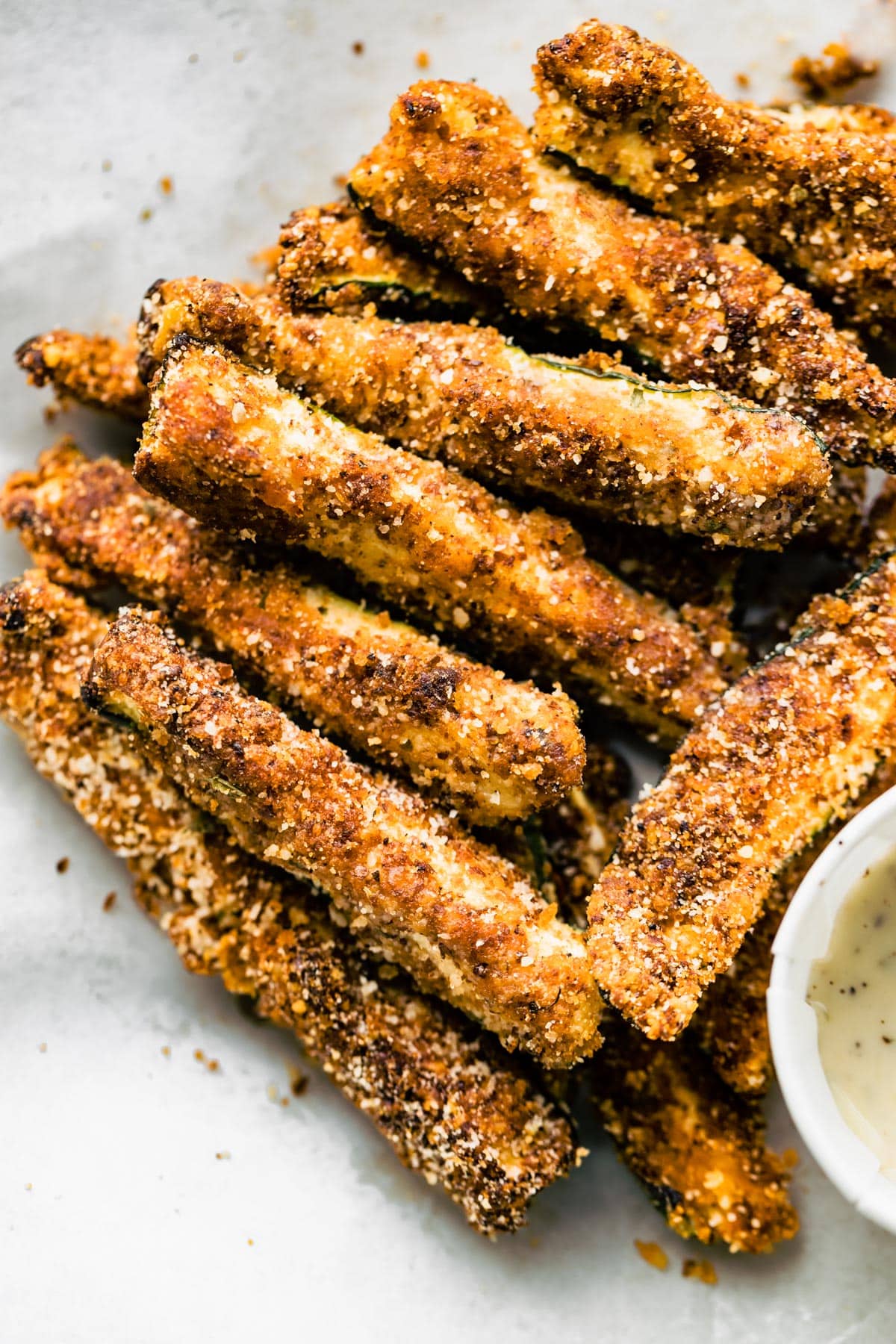 Gluten-free air fryer fries in a parchment paper lined basket.